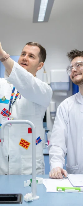 Science lecturer showing a petri dish to a student in a practical lab session at Glasgow Kelvin College Science lecturer showing a petri dish to a student in a practical lab session at Glasgow Kelvin College